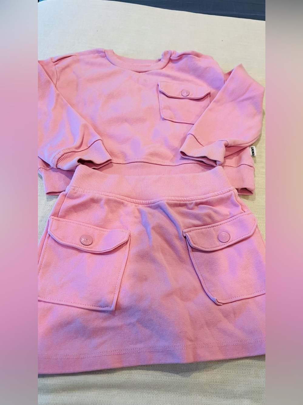 DKNY Pink Two-Piece Pocket Sweatshirt and Skirt Set
Girls size 4